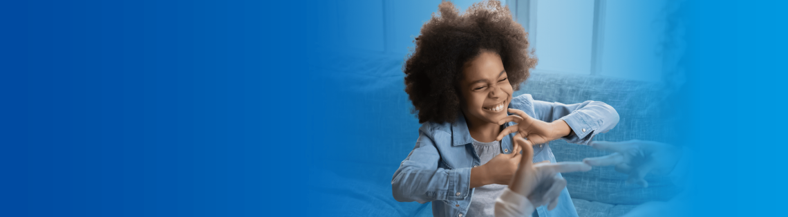 Young girl using sign language
