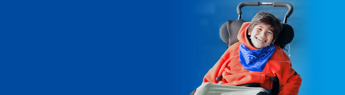 A smiling boy in a wheelchair