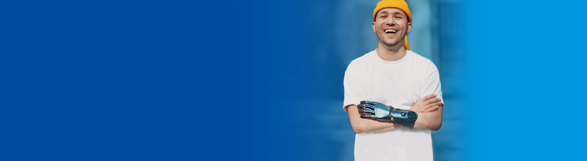 Smiling young man with prosthetic hand