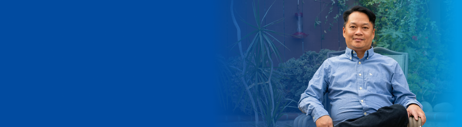 Smiling young man with prosthetic hand